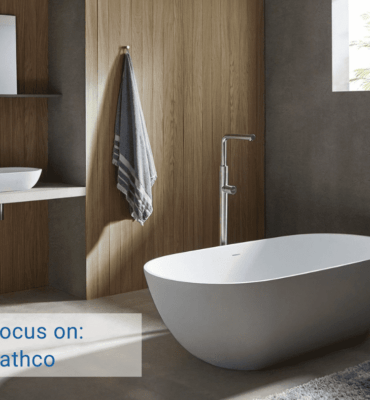 Bathco Bathroom with Freestanding Bathub and Countertop Washbasin