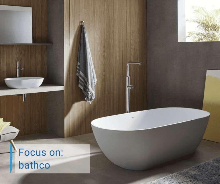 Bathco Bathroom with Freestanding Bathub and Countertop Washbasin