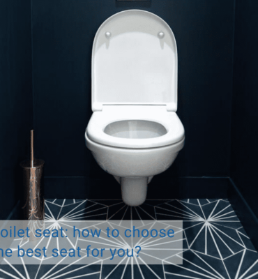 wall hung toilet with toilet seat in a dark blue bathroom