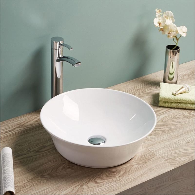 Clean white countertop basin with shining tap