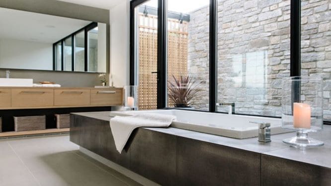 long bathtub with brown cladding