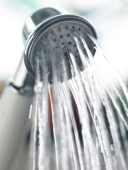running showerhead in a blurry background