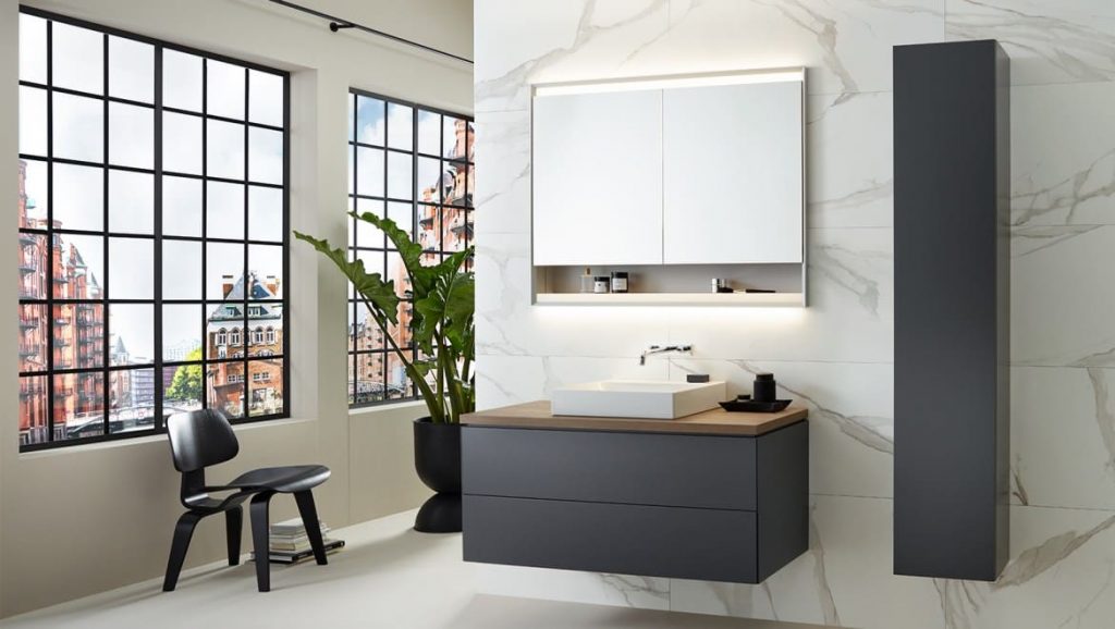 grey Geberit vanity unit cabinet with mirror cabinet in an industrial bathroom