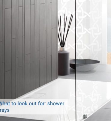 blog cover What to look out for: shower tray. White shower tray on a gray background