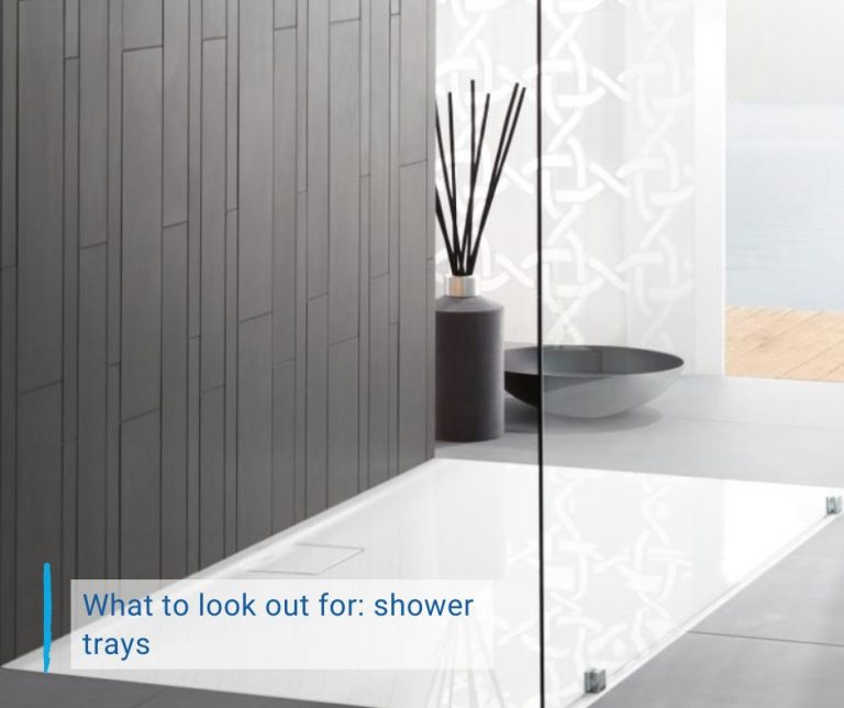 blog cover What to look out for: shower tray. White shower tray on a gray background