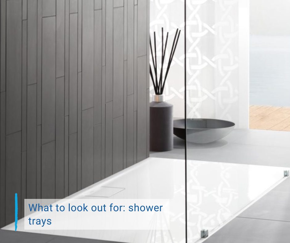 blog cover What to look out for: shower tray. White shower tray on a gray background